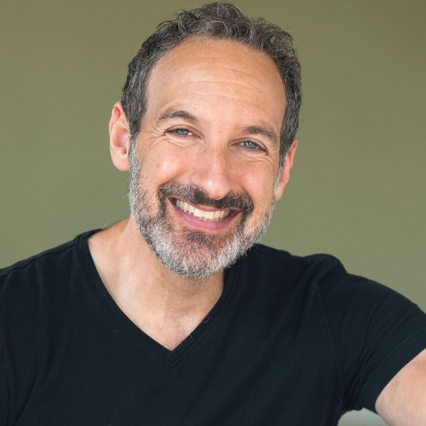 Jay Scherr smiling in a relaxed portrait